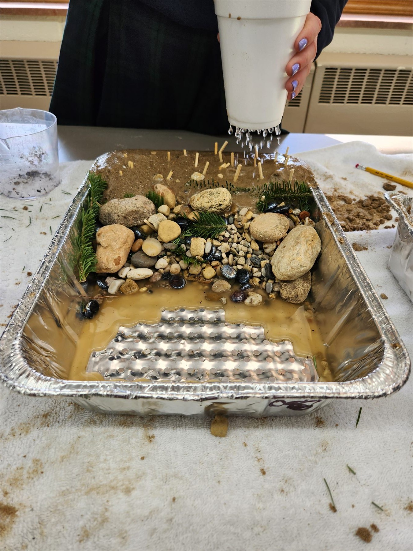 Water moving through a student-made erosion model