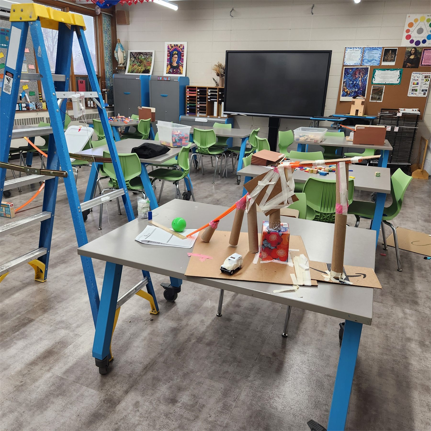 Rube Goldberg machine built from classroom materials
